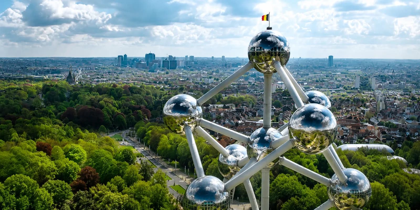 The Atomium in Brussels seen from above, surrounded by trees