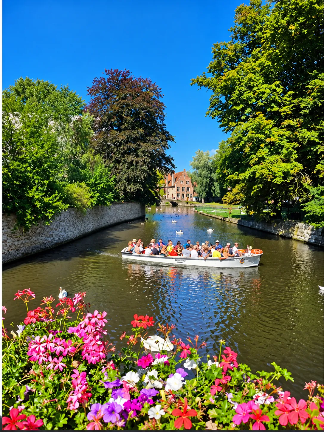 Ghent and Bruges private day tour from Brussels: canal boat ride past flower-lined medieval houses